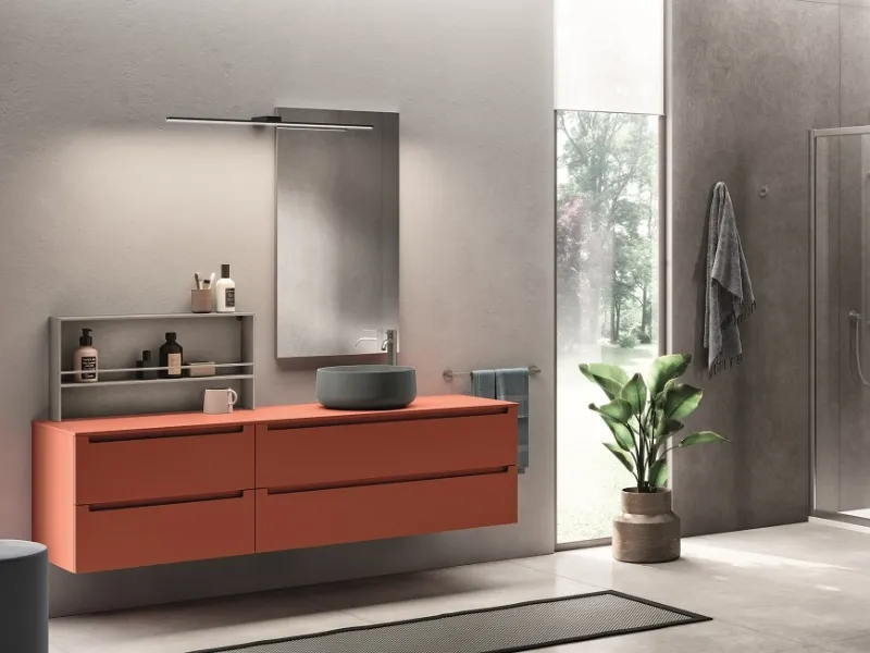Rosso declinato in arancio salmone per la collezione Idra di Scavolini