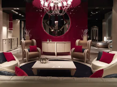 zona living con arredi rosso, panna e nero, tavolino centrale, specchio a parete e lampadario 
